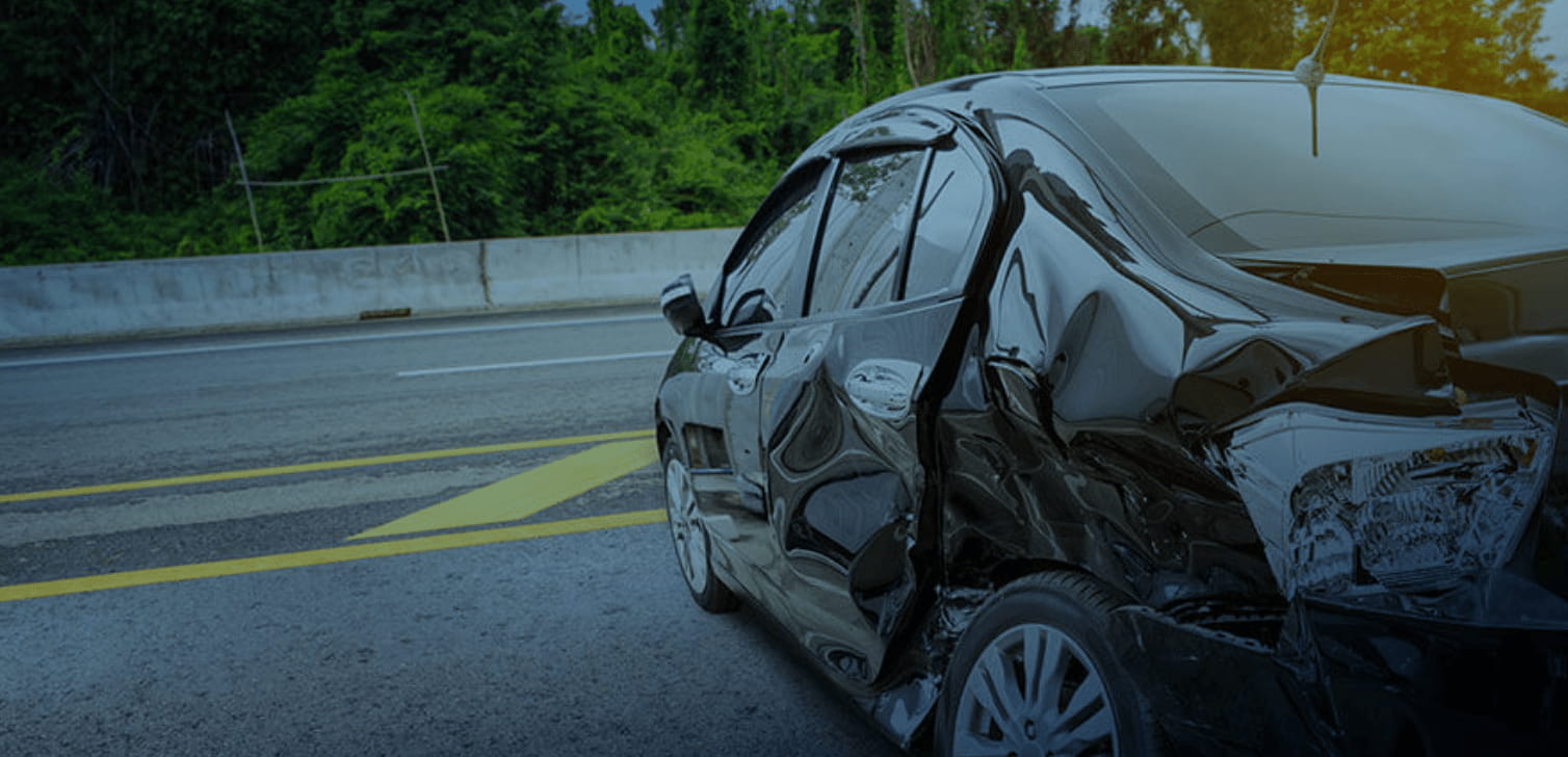 Black car smashed in on driver's side after a car accident | Wisconsin car accident lawyer